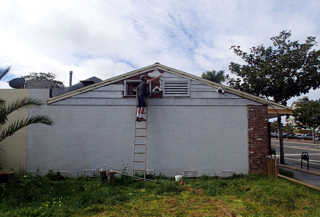 Bryan Snyder preps the Carlsbad Art Wall